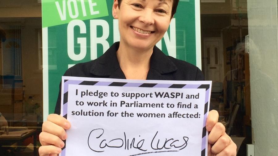 Caroline holding a placard pledging to support WASPI